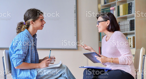 Teen talking with adult